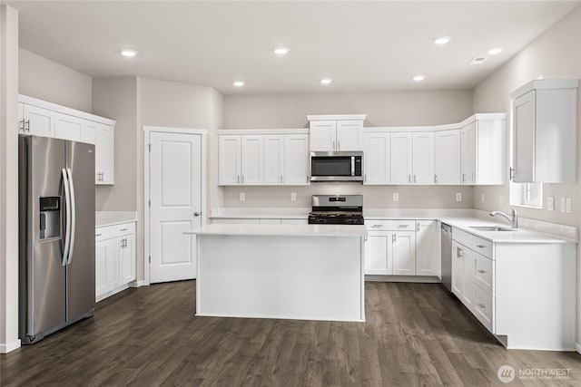 3912 23rd Ave NE Unit 38, Olympia, WA 98506 - kitchen with appliances with stainless steel finishes, dark wood finished floors, light countertops, and recessed lighting