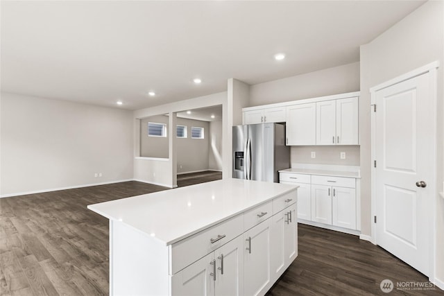 3912 23rd Ave NE Unit 38, Olympia, WA 98506 - kitchen with stainless steel refrigerator with ice dispenser, dark wood finished floors, recessed lighting, white cabinetry, and a center island