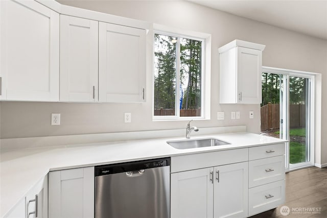 3912 23rd Ave NE Unit 38, Olympia, WA 98506 - kitchen with dishwasher, plenty of natural light, white cabinetry, and wood finished floors