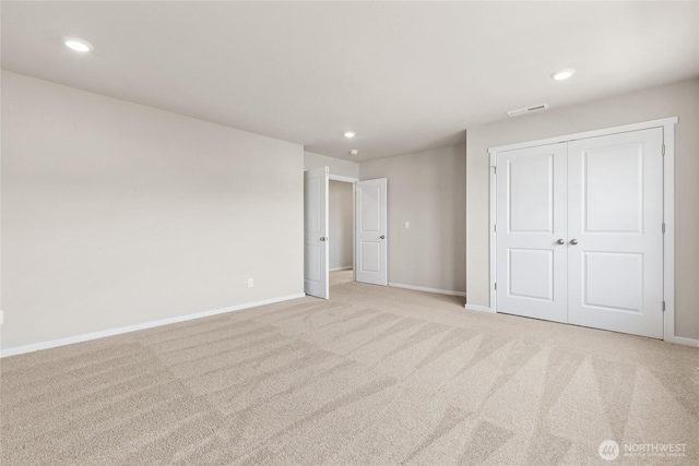 3912 23rd Ave NE Unit 38, Olympia, WA 98506 - unfurnished bedroom featuring light colored carpet, recessed lighting, and a closet