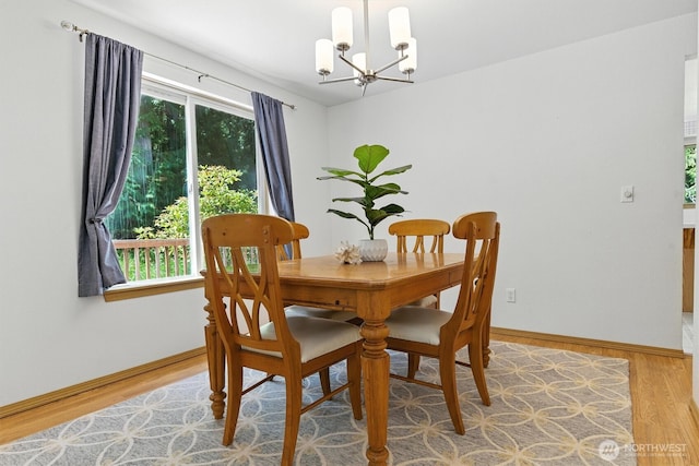 127 E Barnacle Blvd, Shelton, WA 98584 - dining area with a chandelier and light wood-type flooring