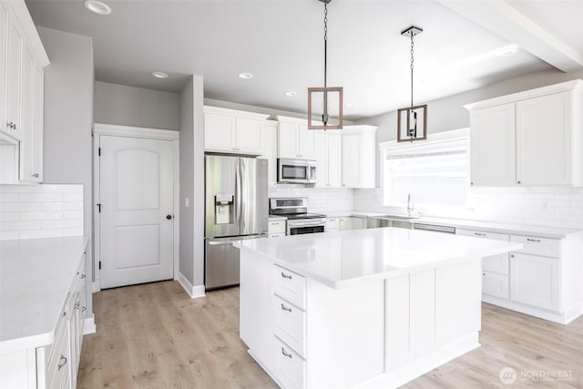 7830 A St, Tacoma, WA 98408 - kitchen featuring stainless steel appliances, decorative backsplash, light wood-style flooring, and recessed lighting