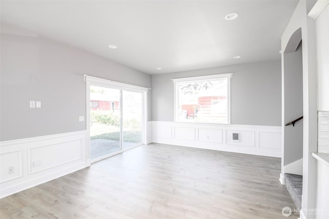 7830 A St, Tacoma, WA 98408 - empty room featuring wainscoting, stairs, a decorative wall, wood finished floors, and recessed lighting