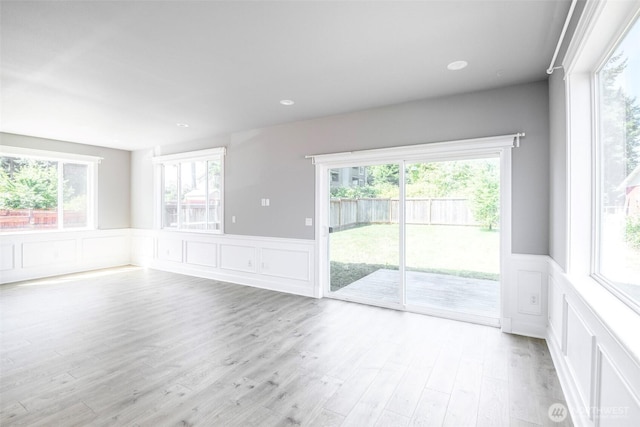 7830 A St, Tacoma, WA 98408 - unfurnished room with a decorative wall, a wainscoted wall, light wood-style floors, and recessed lighting