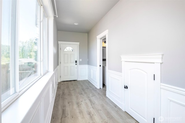 7830 A St, Tacoma, WA 98408 - entryway featuring wainscoting, light wood finished floors, and a decorative wall