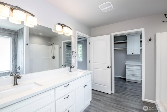 7830 A St, Tacoma, WA 98408 - full bathroom with a shower, double vanity, and wood finished floors