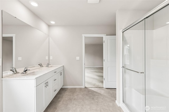 3929 23rd Ave NE Unit 99, Olympia, WA 98506 - bathroom with double vanity, a shower with door, and recessed lighting