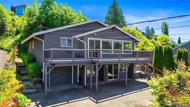 1418 W Mukilteo Blvd, Everett, WA 98203 - rear view of house with stairs, a deck, and a garage