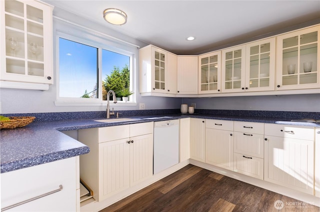 1418 W Mukilteo Blvd, Everett, WA 98203 - kitchen featuring white dishwasher, dark wood finished floors, glass insert cabinets, dark countertops, and recessed lighting