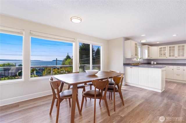 1418 W Mukilteo Blvd, Everett, WA 98203 - dining room with light wood-style floors, a textured ceiling, and recessed lighting