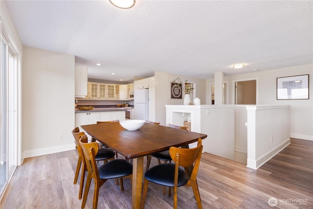 1418 W Mukilteo Blvd, Everett, WA 98203 - dining area featuring a textured ceiling, light wood-type flooring, and recessed lighting