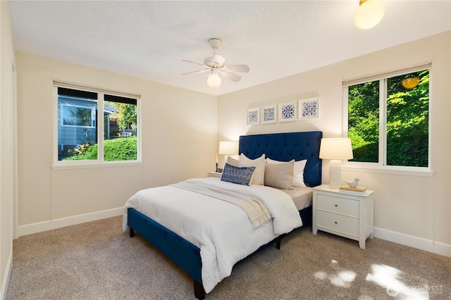 1418 W Mukilteo Blvd, Everett, WA 98203 - bedroom with multiple windows, carpet flooring, and a ceiling fan