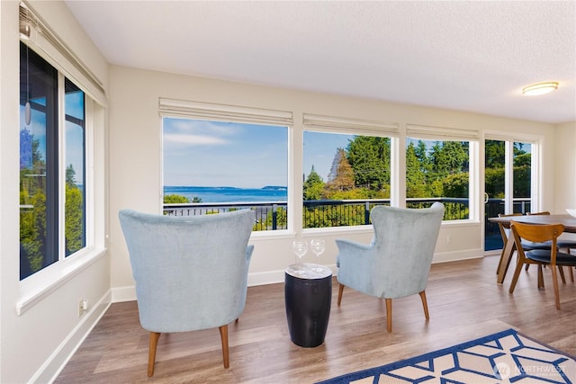 1418 W Mukilteo Blvd, Everett, WA 98203 - sunroom / solarium with healthy amount of natural light, wood finished floors, a water view, and a textured ceiling