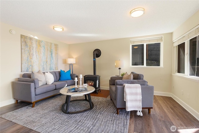 1418 W Mukilteo Blvd, Everett, WA 98203 - living area with a wood stove, wood finished floors, and a textured ceiling