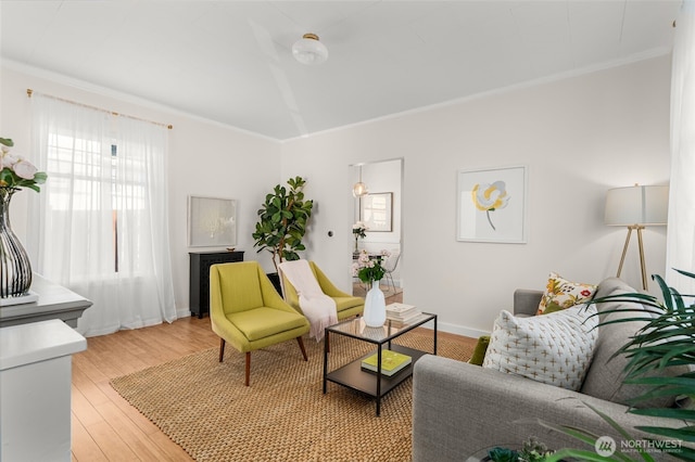 4506 46th Ave SW, Seattle, WA 98116 - living room featuring crown molding and light wood-style flooring