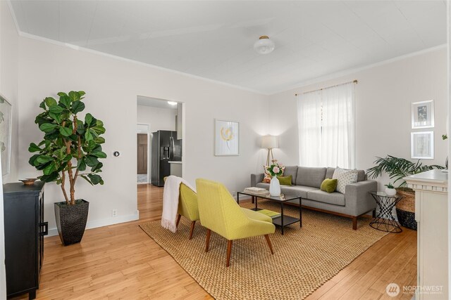 4506 46th Ave SW, Seattle, WA 98116 - living area featuring crown molding and light wood-style floors