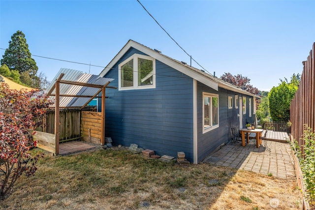 4506 46th Ave SW, Seattle, WA 98116 - view of home's exterior featuring a fenced backyard and a patio area