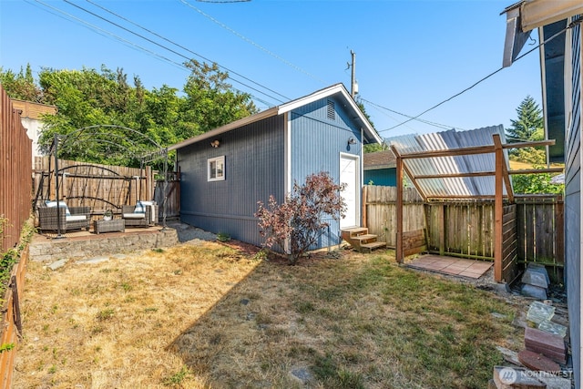 4506 46th Ave SW, Seattle, WA 98116 - rear view of property with an outdoor hangout area, a fenced backyard, and entry steps