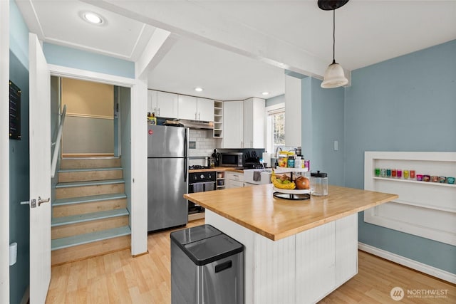 3302 W Tapps Dr E, Lake Tapps, WA 98391 - kitchen featuring stainless steel appliances, open shelves, white cabinets, wooden counters, and light wood-type flooring