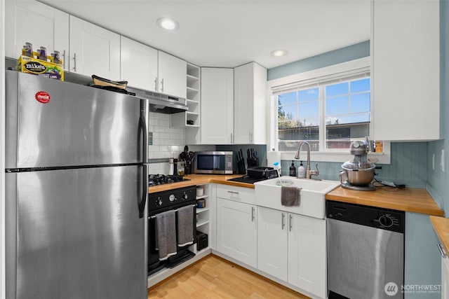 3302 W Tapps Dr E, Lake Tapps, WA 98391 - kitchen with black appliances, butcher block countertops, open shelves, white cabinetry, and recessed lighting