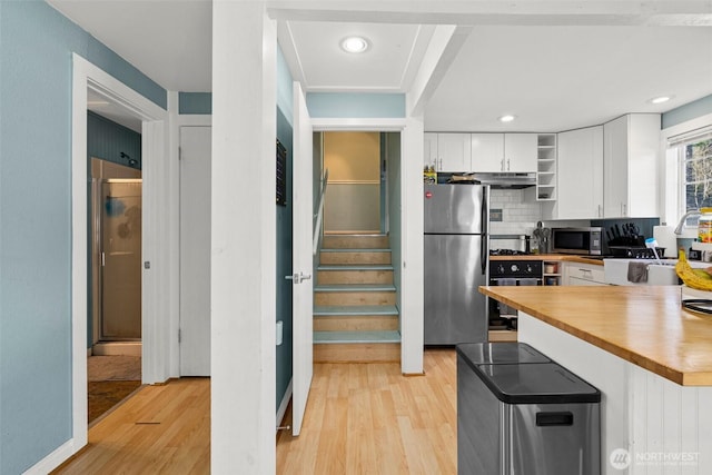 3302 W Tapps Dr E, Lake Tapps, WA 98391 - kitchen featuring stainless steel appliances, open shelves, light wood finished floors, white cabinetry, and recessed lighting