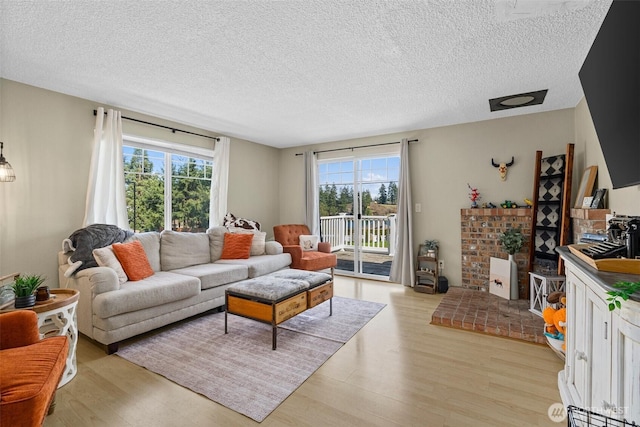 3302 W Tapps Dr E, Lake Tapps, WA 98391 - living area with light wood finished floors and a textured ceiling
