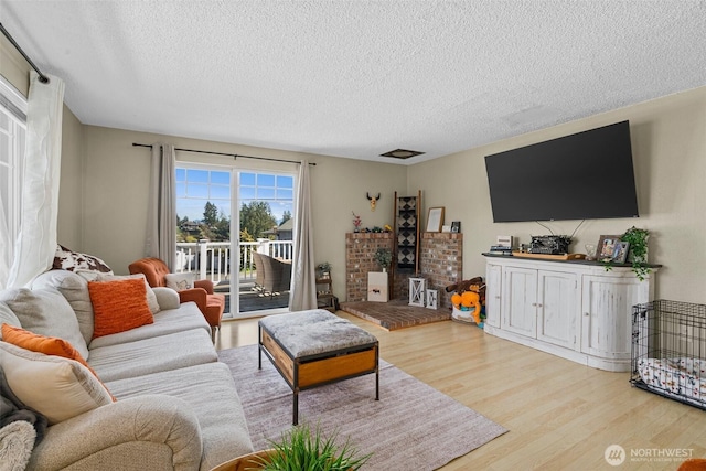 3302 W Tapps Dr E, Lake Tapps, WA 98391 - living room with a textured ceiling and wood finished floors