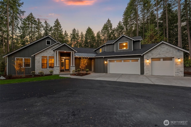 332 138th Pl SE, Auburn, WA 98092 - view of front of house featuring board and batten siding, brick siding, concrete driveway, and an attached garage