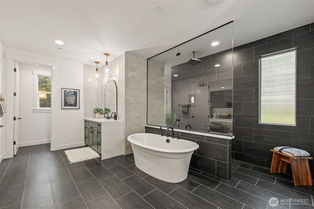332 138th Pl SE, Auburn, WA 98092 - bathroom with tile walls, vanity, a soaking tub, a walk in shower, and tile patterned flooring
