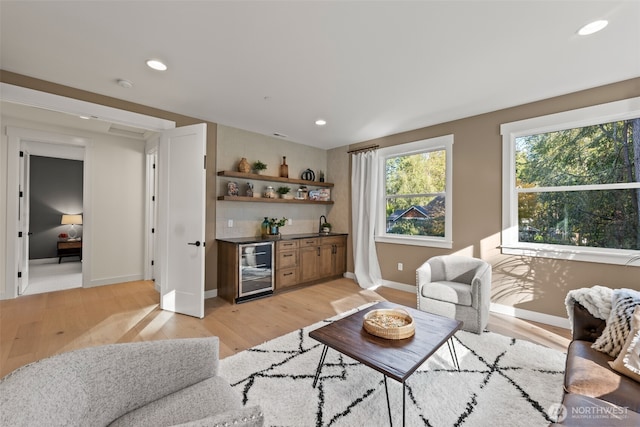 332 138th Pl SE, Auburn, WA 98092 - living room with wet bar, beverage cooler, light wood-style floors, and recessed lighting