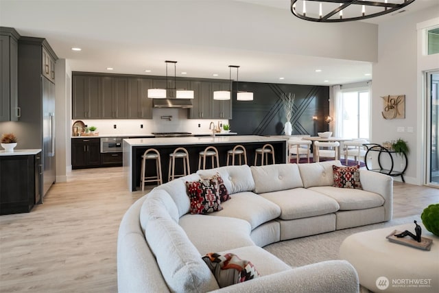 332 138th Pl SE, Auburn, WA 98092 - living area with light wood-type flooring, recessed lighting, and a chandelier
