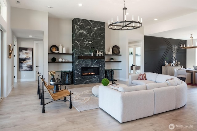 332 138th Pl SE, Auburn, WA 98092 - living area with a chandelier, wood finished floors, recessed lighting, and a premium fireplace