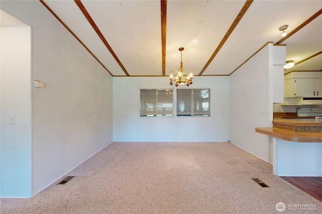 589 Criscola Ave, College Place, WA 99324 - unfurnished dining area with carpet, a chandelier, and vaulted ceiling