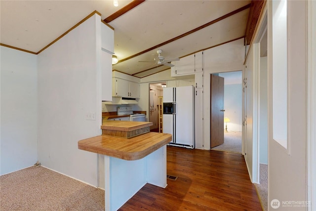 589 Criscola Ave, College Place, WA 99324 - kitchen featuring white appliances, vaulted ceiling, a peninsula, dark wood-style flooring, and white cabinetry