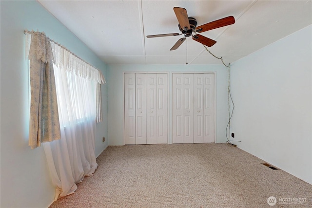 589 Criscola Ave, College Place, WA 99324 - unfurnished bedroom with multiple closets, light carpet, and a ceiling fan