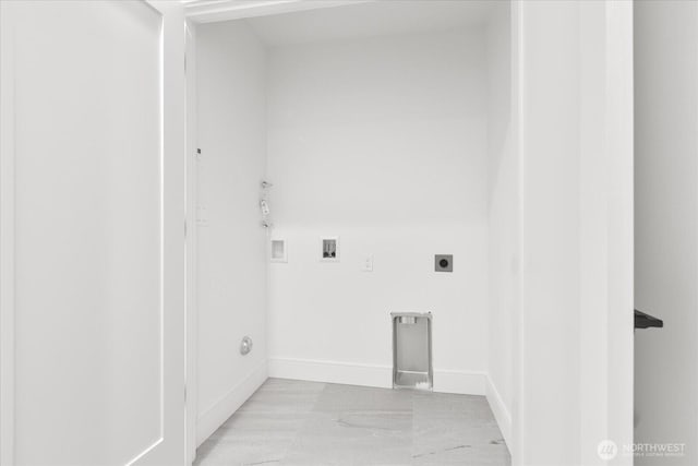 747 N 71st St, Seattle, WA 98103 - laundry area with electric dryer hookup, washer hookup, and light marble finish floors