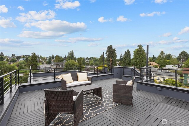 747 N 71st St, Seattle, WA 98103 - wooden deck featuring view of scattered trees and an outdoor living space