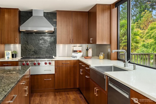 19081 11th Ave NW, Shoreline, WA 98177 - kitchen with exhaust hood, stainless steel appliances, dark wood finished floors, tasteful backsplash, and light stone countertops