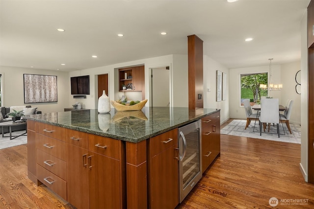 19081 11th Ave NW, Shoreline, WA 98177 - kitchen with wine cooler, dark wood finished floors, recessed lighting, a kitchen island, and a chandelier
