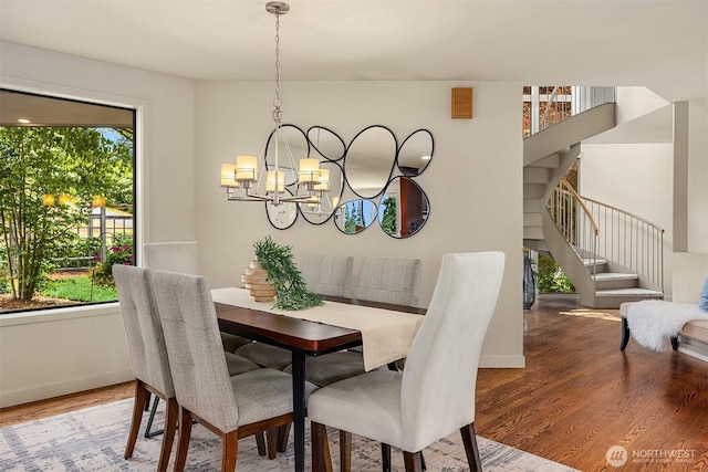 19081 11th Ave NW, Shoreline, WA 98177 - dining space with plenty of natural light, wood finished floors, a chandelier, and stairs
