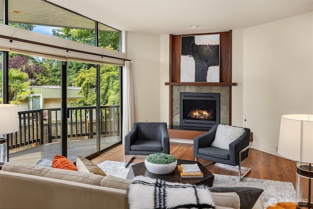 19081 11th Ave NW, Shoreline, WA 98177 - living room with a lit fireplace and wood finished floors