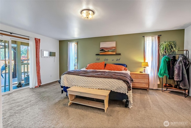 12310 Morris Rd SE, Yelm, WA 98597 - carpeted bedroom with access to exterior and multiple windows