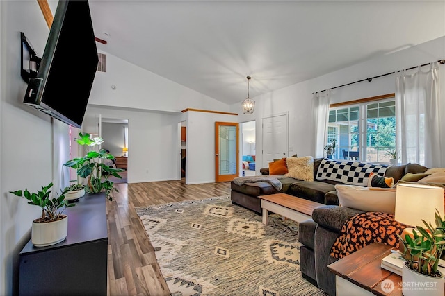 12310 Morris Rd SE, Yelm, WA 98597 - living room featuring wood finished floors and vaulted ceiling