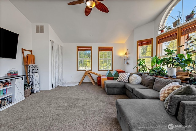 12310 Morris Rd SE, Yelm, WA 98597 - carpeted living room with ceiling fan, healthy amount of natural light, and high vaulted ceiling