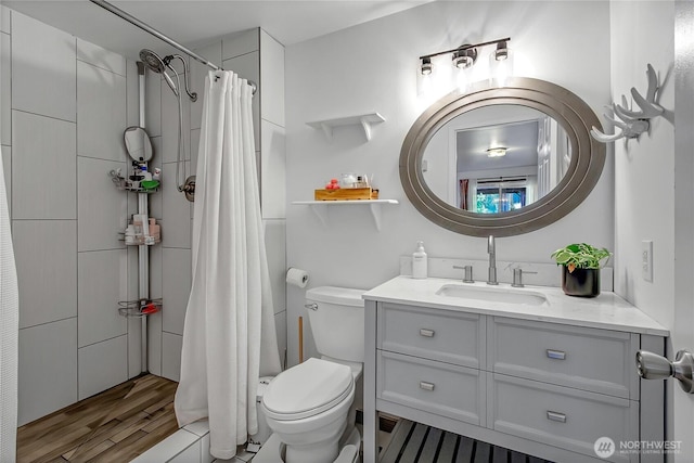 12310 Morris Rd SE, Yelm, WA 98597 - bathroom featuring vanity, tiled shower, and wood finished floors