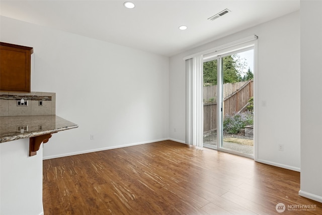 7022 Raptor Ave NE, Lacey, WA 98516 - unfurnished dining area featuring wood finished floors and recessed lighting