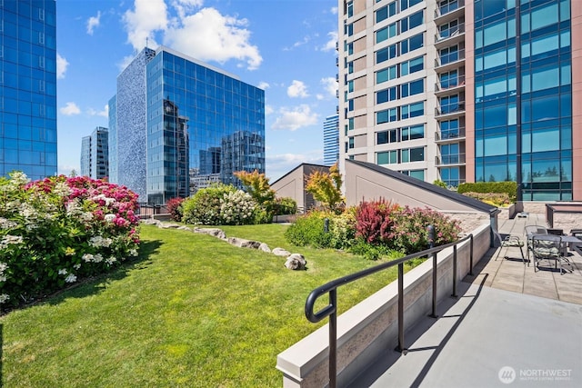 177 107th Ave NE Unit 1906, Bellevue, WA 98004 - view of property's community with a yard and a city view
