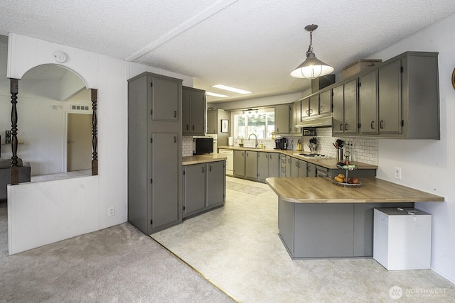 1729 154th St S, Spanaway, WA 98387 - kitchen featuring gray cabinetry, a textured ceiling, a peninsula, backsplash, and white appliances