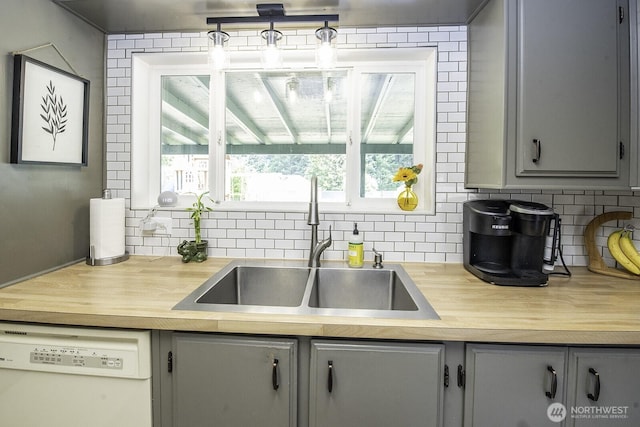 1729 154th St S, Spanaway, WA 98387 - kitchen featuring dishwasher, gray cabinets, backsplash, and wooden counters
