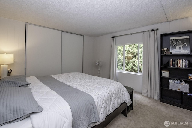 1729 154th St S, Spanaway, WA 98387 - carpeted bedroom featuring a closet and a textured ceiling